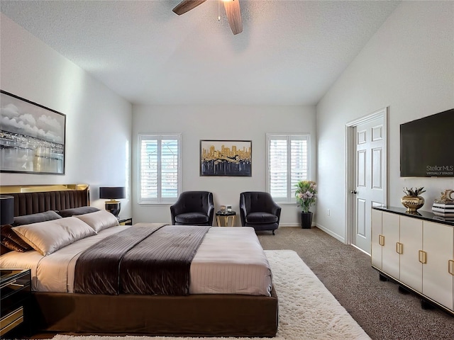 carpeted bedroom with ceiling fan, a textured ceiling, and vaulted ceiling