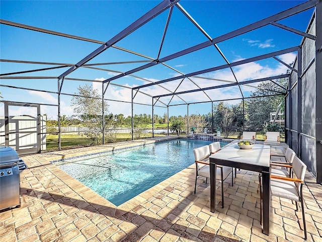 view of pool with a lanai and a patio area