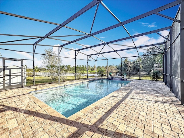 view of pool featuring a patio area and a lanai