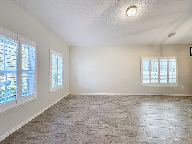 empty room featuring a textured ceiling