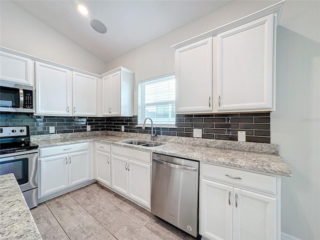 kitchen with sink, white cabinets, and stainless steel appliances