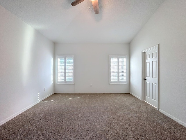 carpeted empty room featuring a textured ceiling and ceiling fan