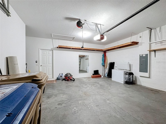 garage with a garage door opener and electric panel