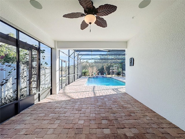 view of pool featuring ceiling fan