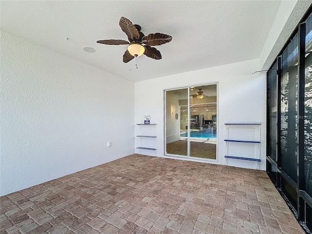 spare room with a textured ceiling