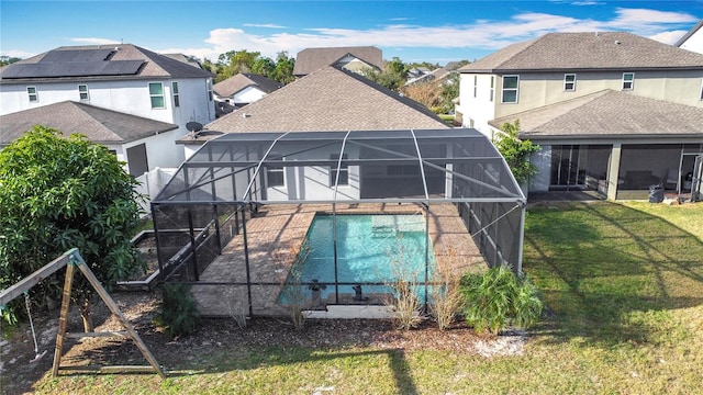 view of pool featuring a lanai and a yard