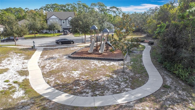 view of property's community with a playground