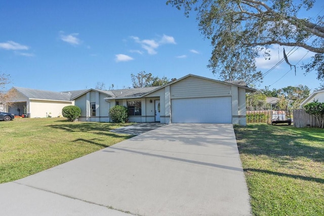 ranch-style home with a front lawn and a garage