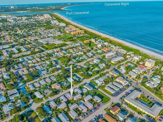 birds eye view of property featuring a view of the beach and a water view