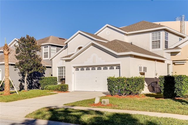 front facade featuring a front yard and a garage