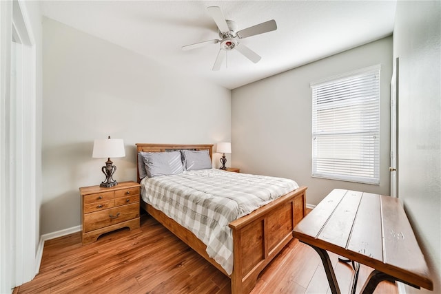 bedroom featuring ceiling fan and light hardwood / wood-style flooring