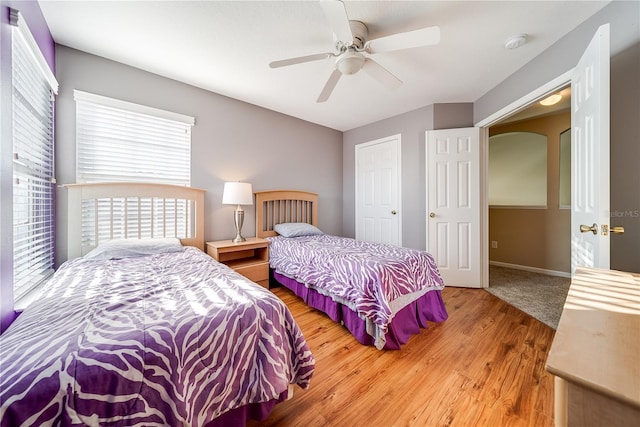 bedroom with hardwood / wood-style flooring and ceiling fan