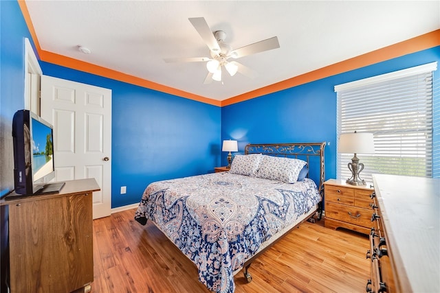 bedroom featuring hardwood / wood-style flooring and ceiling fan