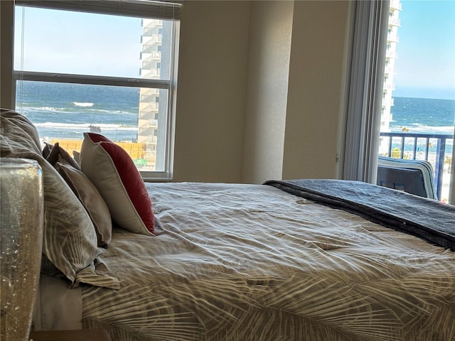 bedroom featuring a water view