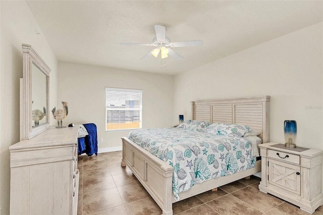 tiled bedroom featuring ceiling fan