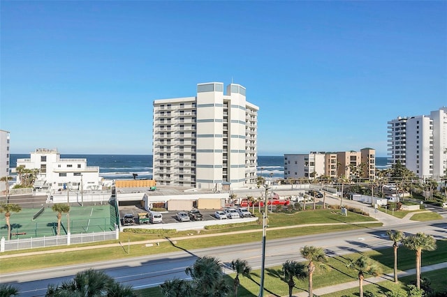 birds eye view of property with a water view