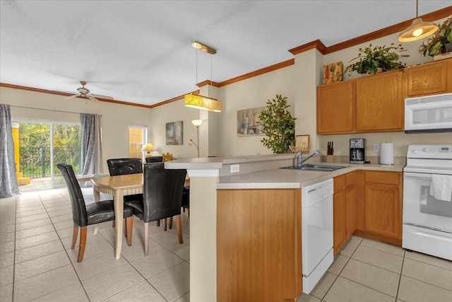 kitchen with kitchen peninsula, white appliances, a textured ceiling, pendant lighting, and sink