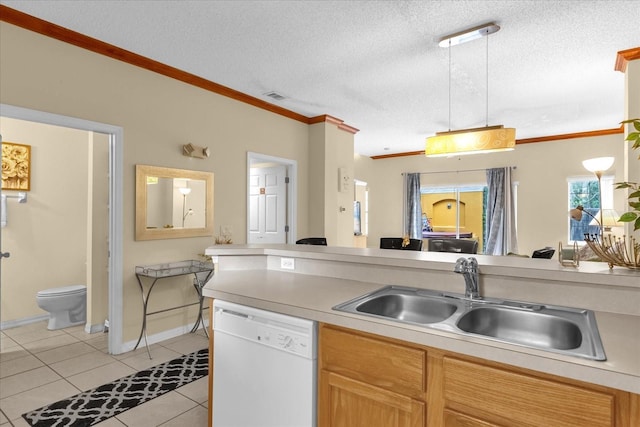 kitchen with a textured ceiling, pendant lighting, sink, white dishwasher, and light tile patterned floors