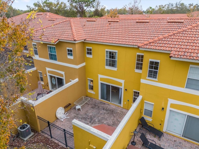 back of house featuring a patio area and cooling unit