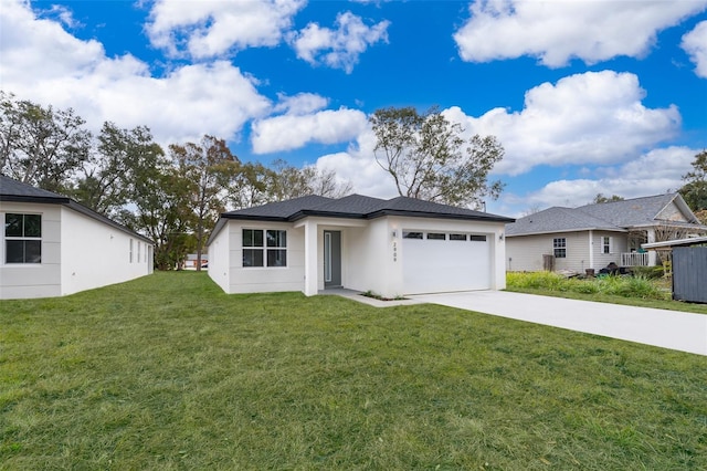 view of front of home featuring a front yard and a garage