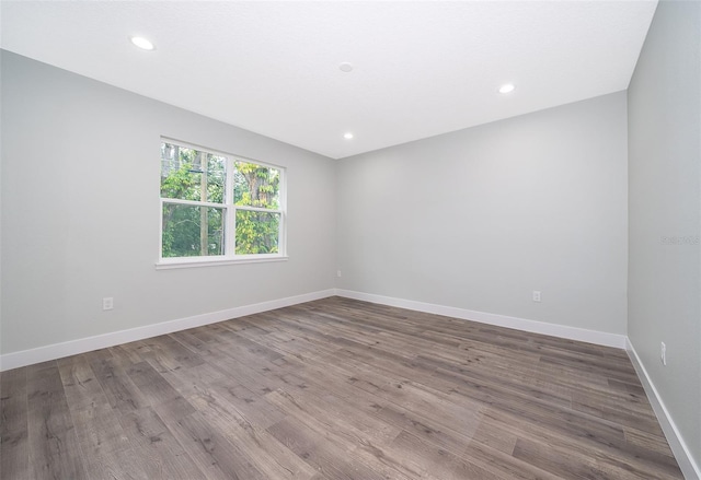 empty room with hardwood / wood-style floors