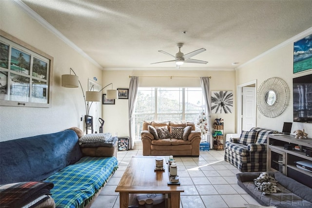 living room featuring a textured ceiling, ceiling fan, ornamental molding, and light tile patterned floors