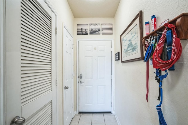 entryway featuring light tile patterned floors