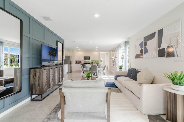 living room with light tile patterned floors