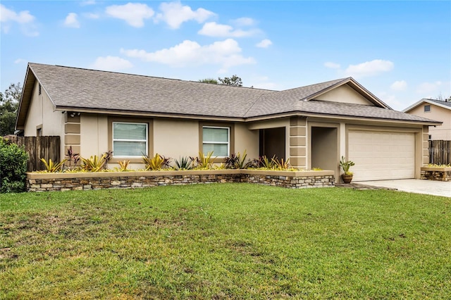 single story home featuring a garage and a front lawn