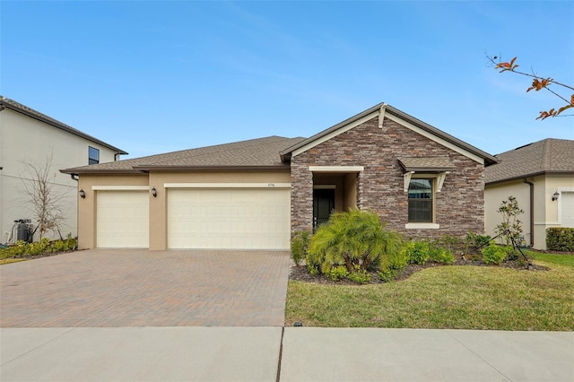 view of front facade with a garage and a front lawn