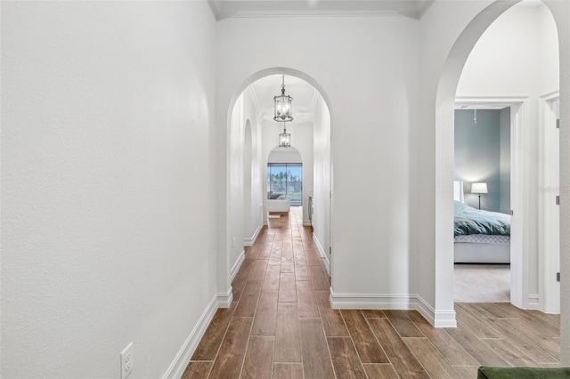 corridor featuring crown molding