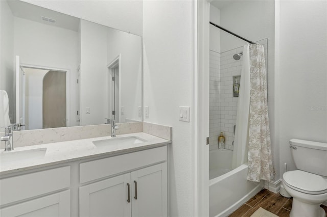 full bathroom featuring toilet, vanity, and shower / bathtub combination with curtain