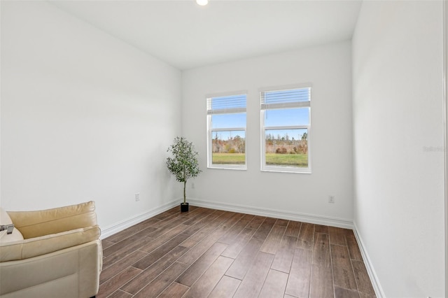 spare room featuring dark hardwood / wood-style floors