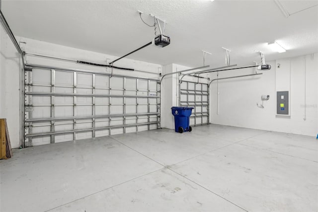 garage featuring a garage door opener and electric panel