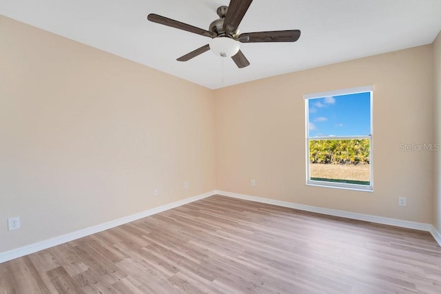 spare room with ceiling fan and light hardwood / wood-style floors