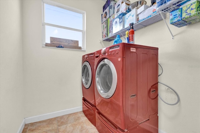 washroom featuring light tile patterned flooring and independent washer and dryer