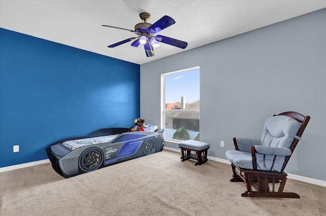 bedroom with ceiling fan and carpet floors