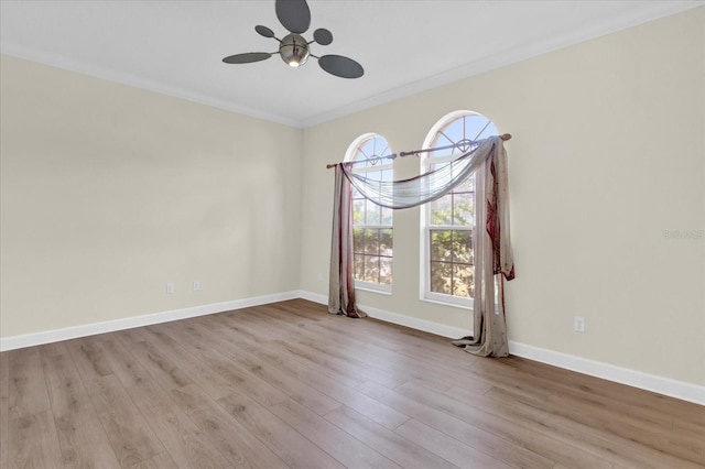 unfurnished room featuring crown molding, ceiling fan, and light hardwood / wood-style flooring