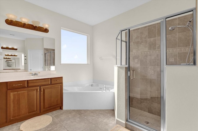 bathroom featuring vanity, tile patterned flooring, and plus walk in shower