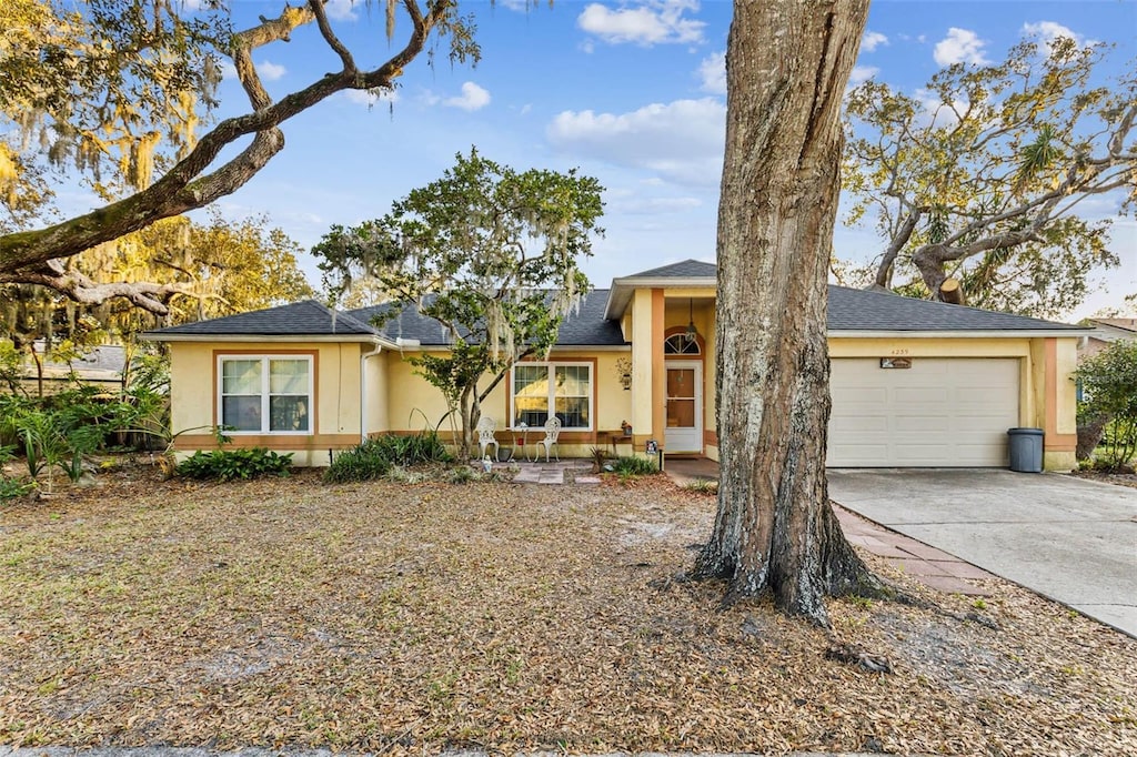 ranch-style home featuring a garage