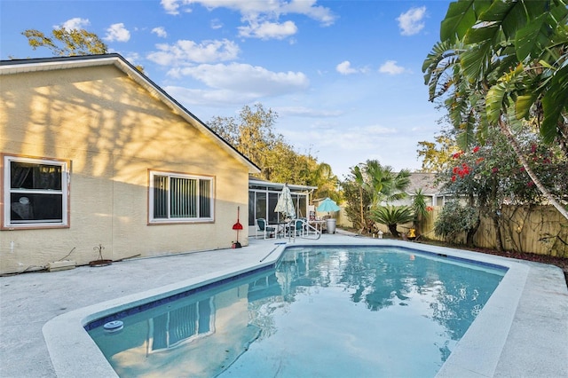 view of swimming pool featuring a patio area