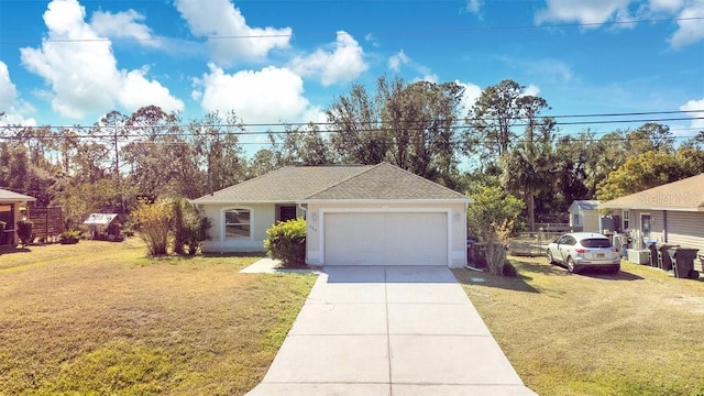 view of front of house with a garage and a front lawn