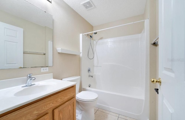 full bathroom with tile patterned floors, a textured ceiling, toilet, vanity, and shower / bathtub combination