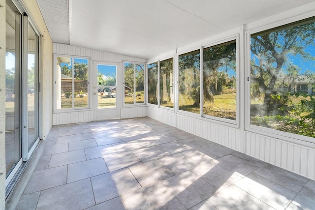 unfurnished sunroom featuring plenty of natural light