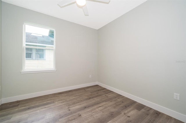 spare room with ceiling fan and hardwood / wood-style flooring