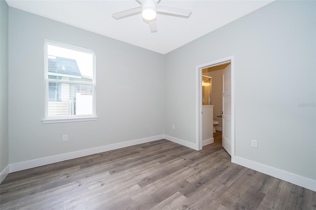 unfurnished room featuring ceiling fan and light wood-type flooring