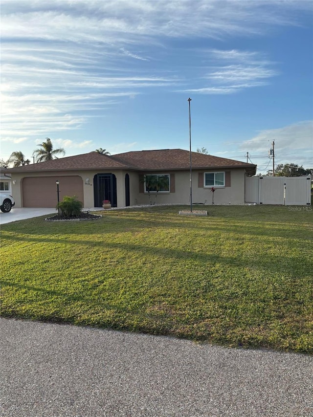 single story home with a front yard and a garage