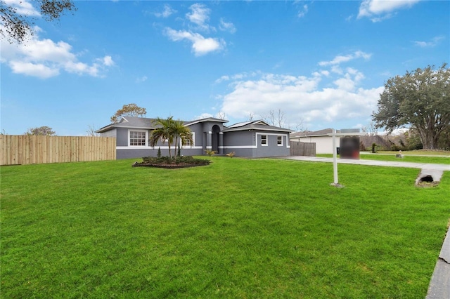 ranch-style house featuring a front lawn