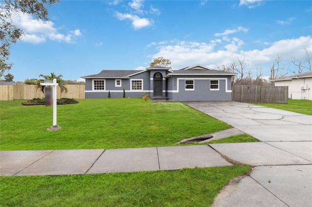 ranch-style home with a front lawn