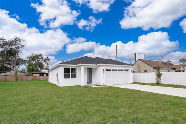 view of front of house featuring a garage and a front yard